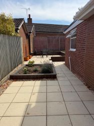 Secure patio area, east facing.