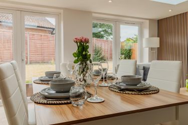 Main dining area with French doors to the rear