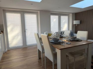 Dining area with French doors with integral blinds