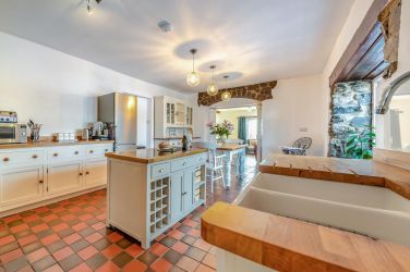 Two washing machines, tumble dryer, iron