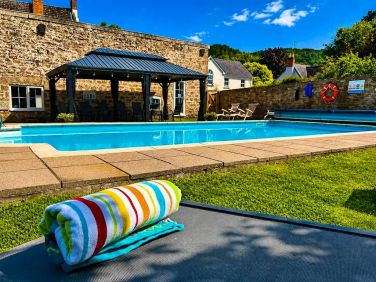 Unwind by the pool and enjoy the peaceful surroundings &mdash; an idyllic spot to relax