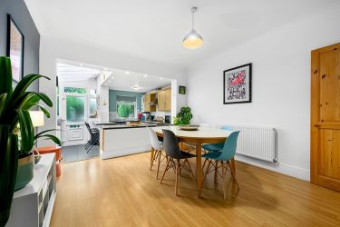 Open plan dining room, kitchen and exit to our garden.