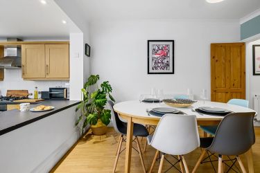 Open plan kitchen/dining room and entrance to the upstairs