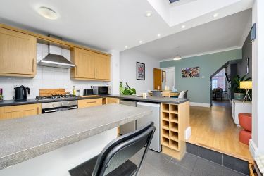 The view from our back door - breakfast bar/kitchen, gas hob, dining room through to front living ro