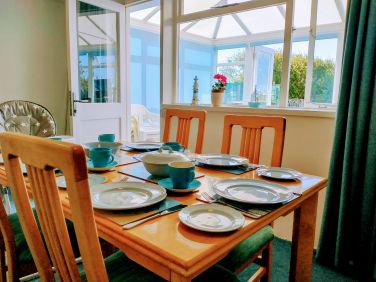Seating for 5 and a high chair in the dining room