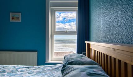 The master bedroom looking straight out to sea