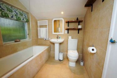 Bathroom with bath and shower