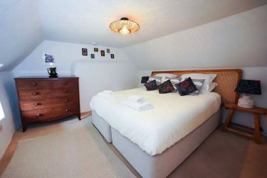 Super king size bed which can be divided into two single beds and view of the garden