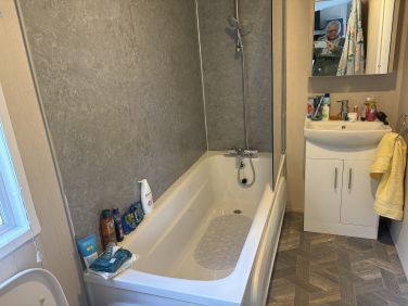 Bathroom with vanity unit/ LED lit mirror