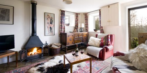 The living room with stable door leaving out to the fields
