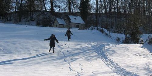 Running down the hill from Jackdaw Cottage on a snowy winter's day