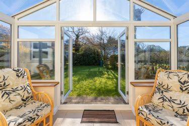 Conservatory opening to side garden