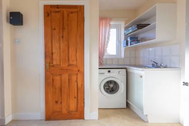 Utility Area off kitchen leads to Conservatory and downstairs Cloak Room