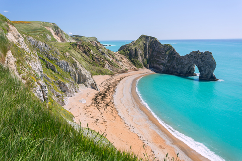Sandy beach, turquoise water & Lulworth Cove as a backdrop