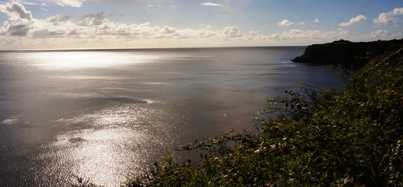 Coastline of Dumfries and Galloway Light shimmering on the water around the headland