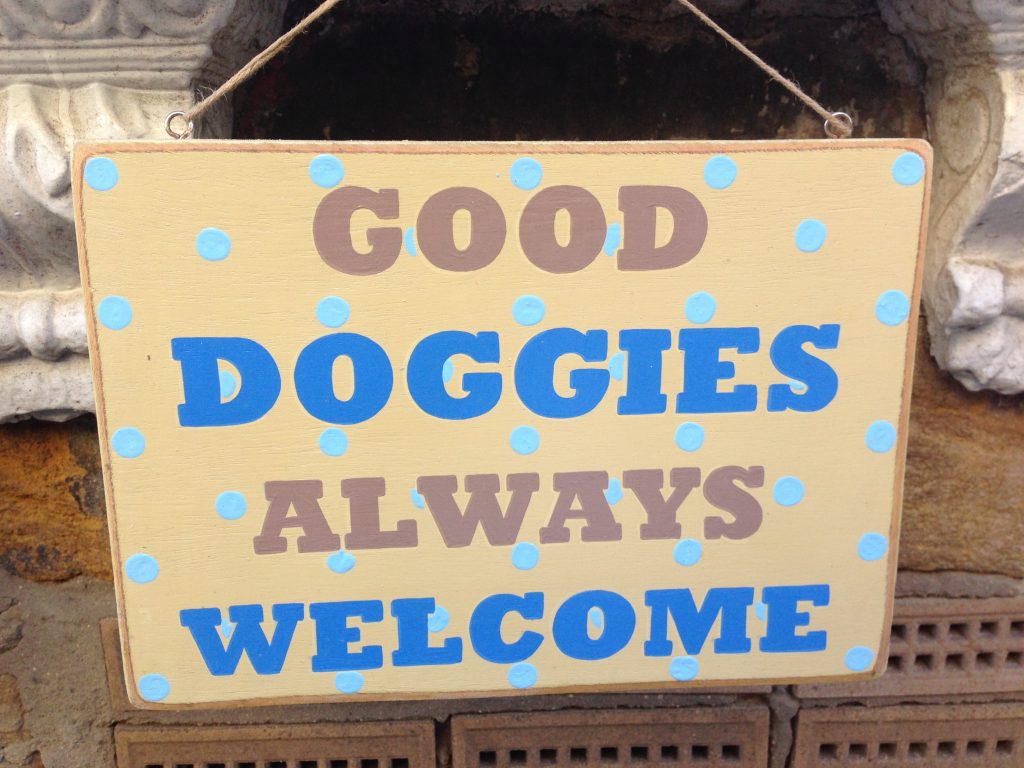 Sign saying 'Good Doggies Always Welcome'