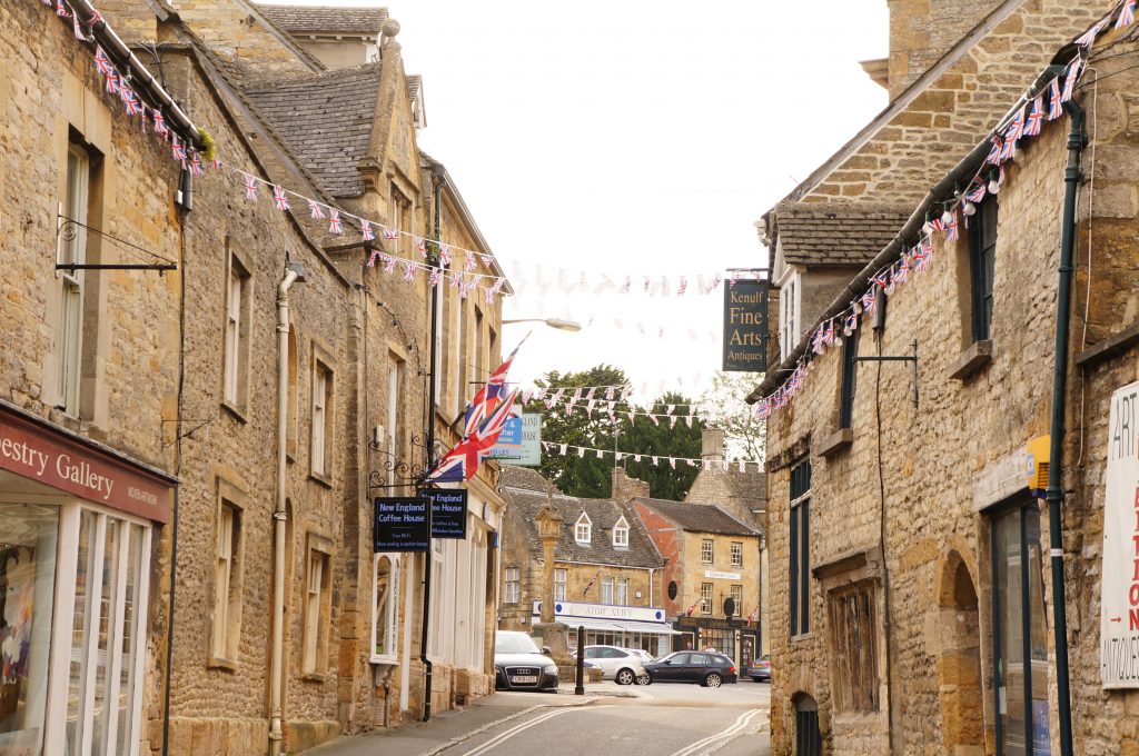 Street view with Cotswolds shops lining the little street