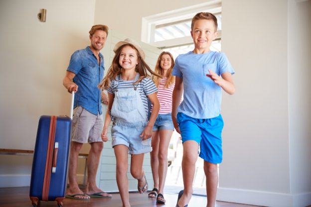 Family arriving at a holiday home